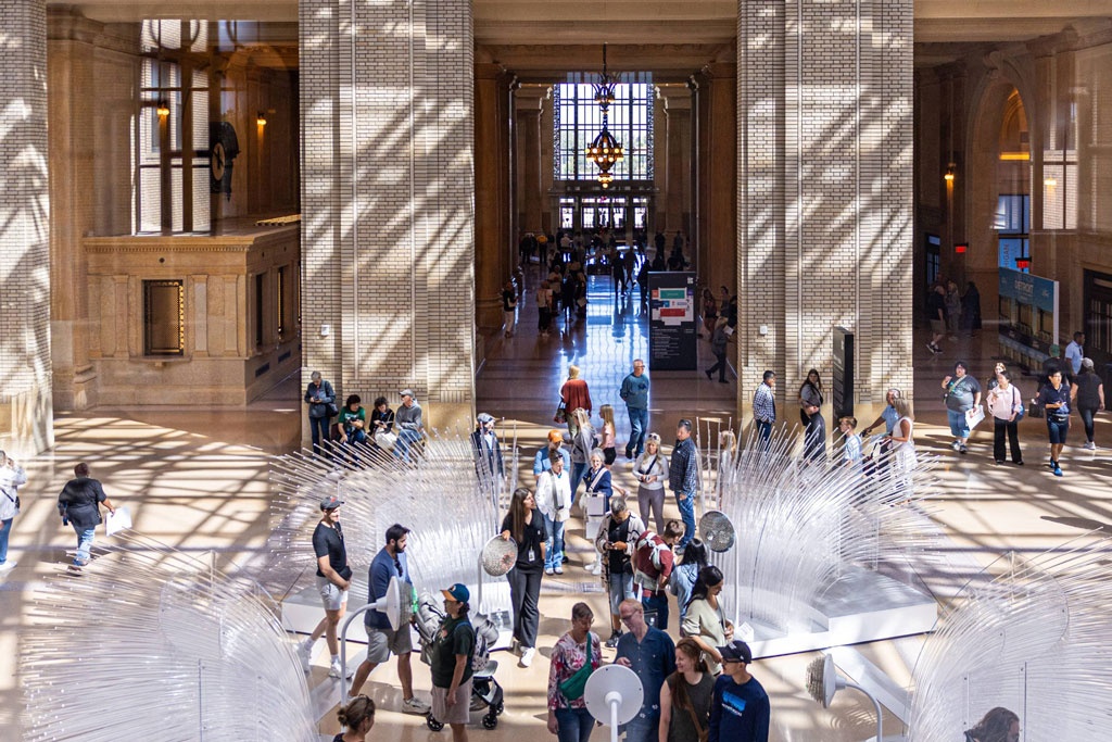 People walk through the interior hall of Michigan Central Station in Detroit. Credit: Stephanie Rhoades Hume, Michigan Center